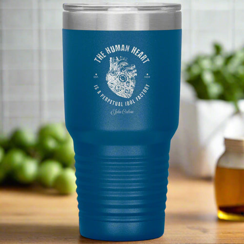 Blue travel mug with white text and design on a white background