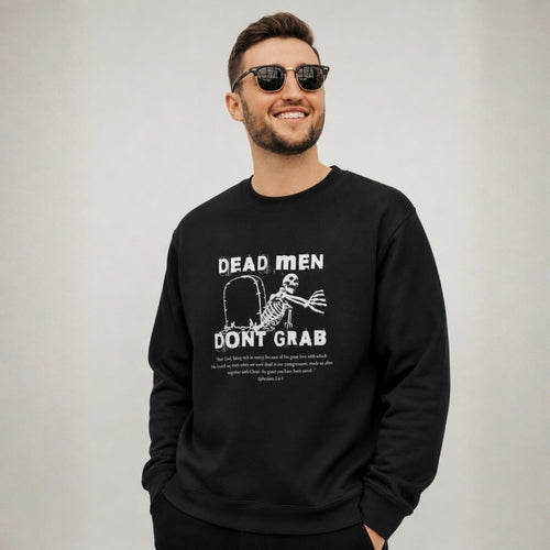 Dead Men Don't Grab crewneck sweatshirt – men's front lifestyle view on light studio backdrop – Calvinist Apparel