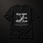Dead Men Don't Grab black unisex tee front flat lay with white skeleton graphic and Ephesians 2:4–5