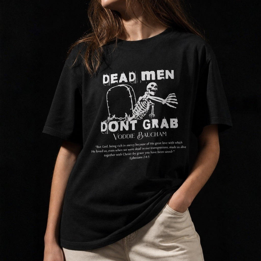Close-up of Dead Men Don't Grab tee print and Ephesians 2:4–5 on female model
