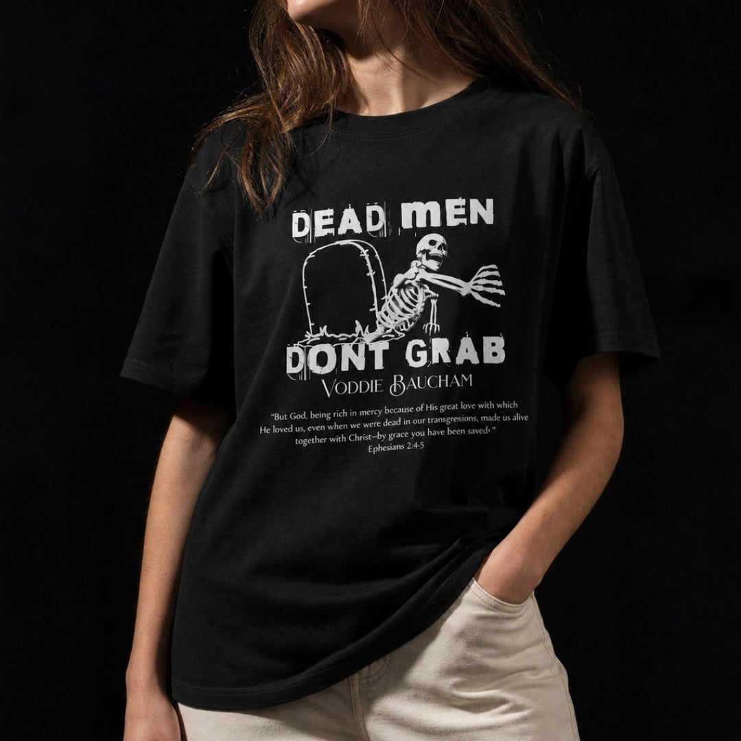 Close-up of Dead Men Don't Grab tee print and Ephesians 2:4–5 on female model