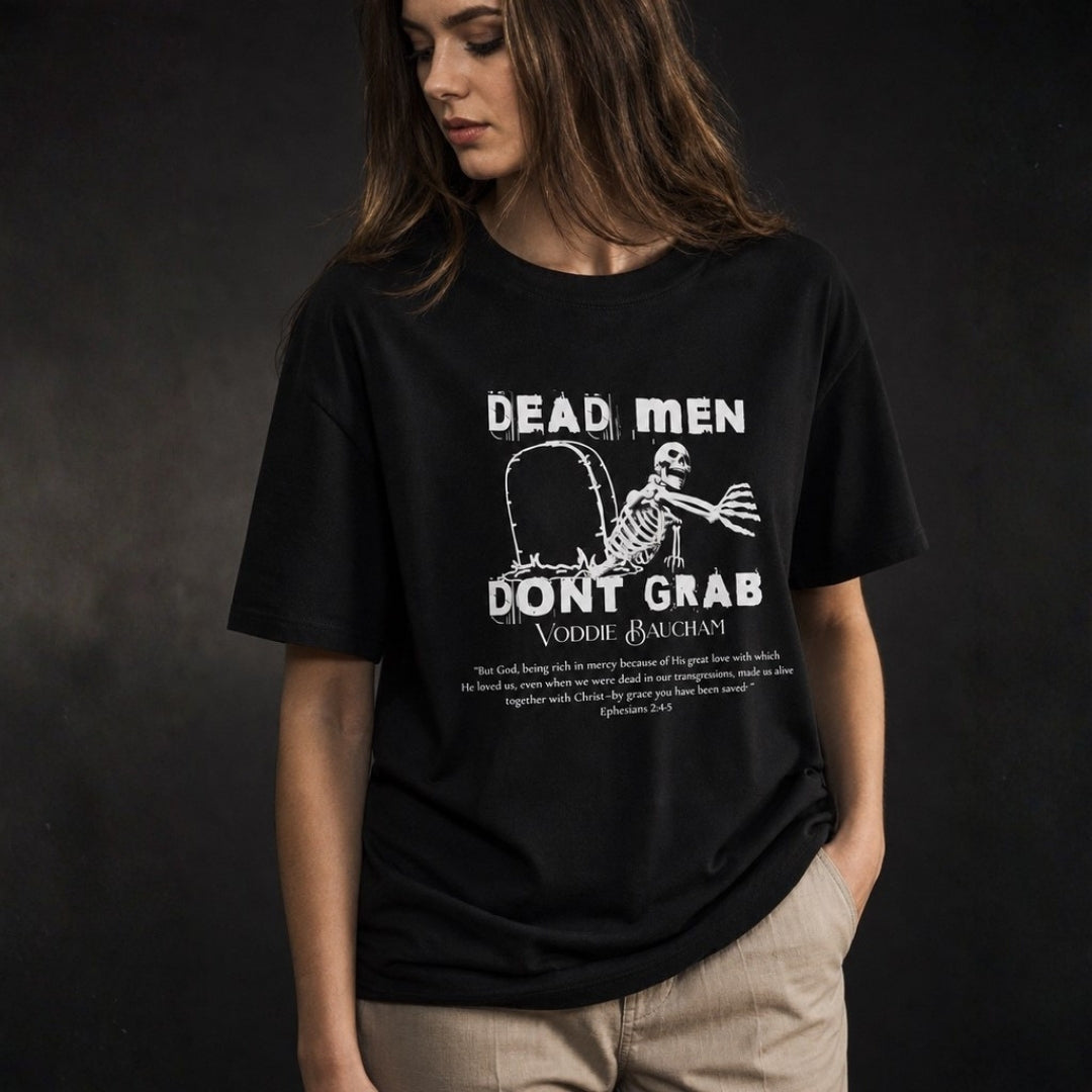 Dead Men Don't Grab black unisex tee on female model with cream trousers
