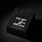 Folded black Dead Men Don't Grab unisex tees with white graphic