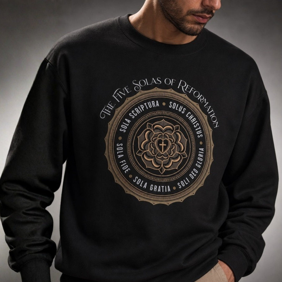 Close-up of Five Solas of Reformation chest design on black crewneck sweatshirt