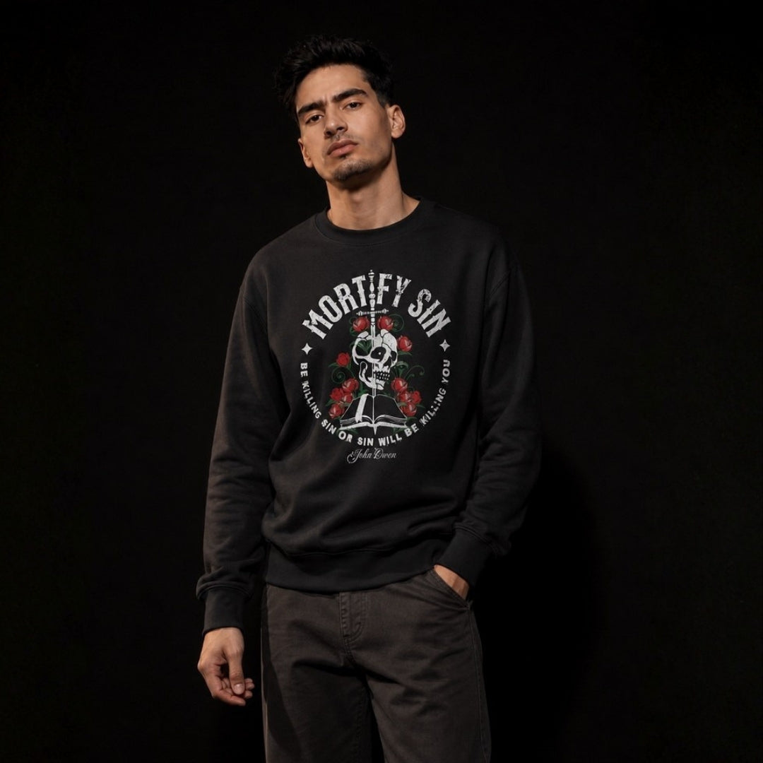 Mortify Sin crewneck sweatshirt – Men's black studio lifestyle full view – Calvinist Apparel