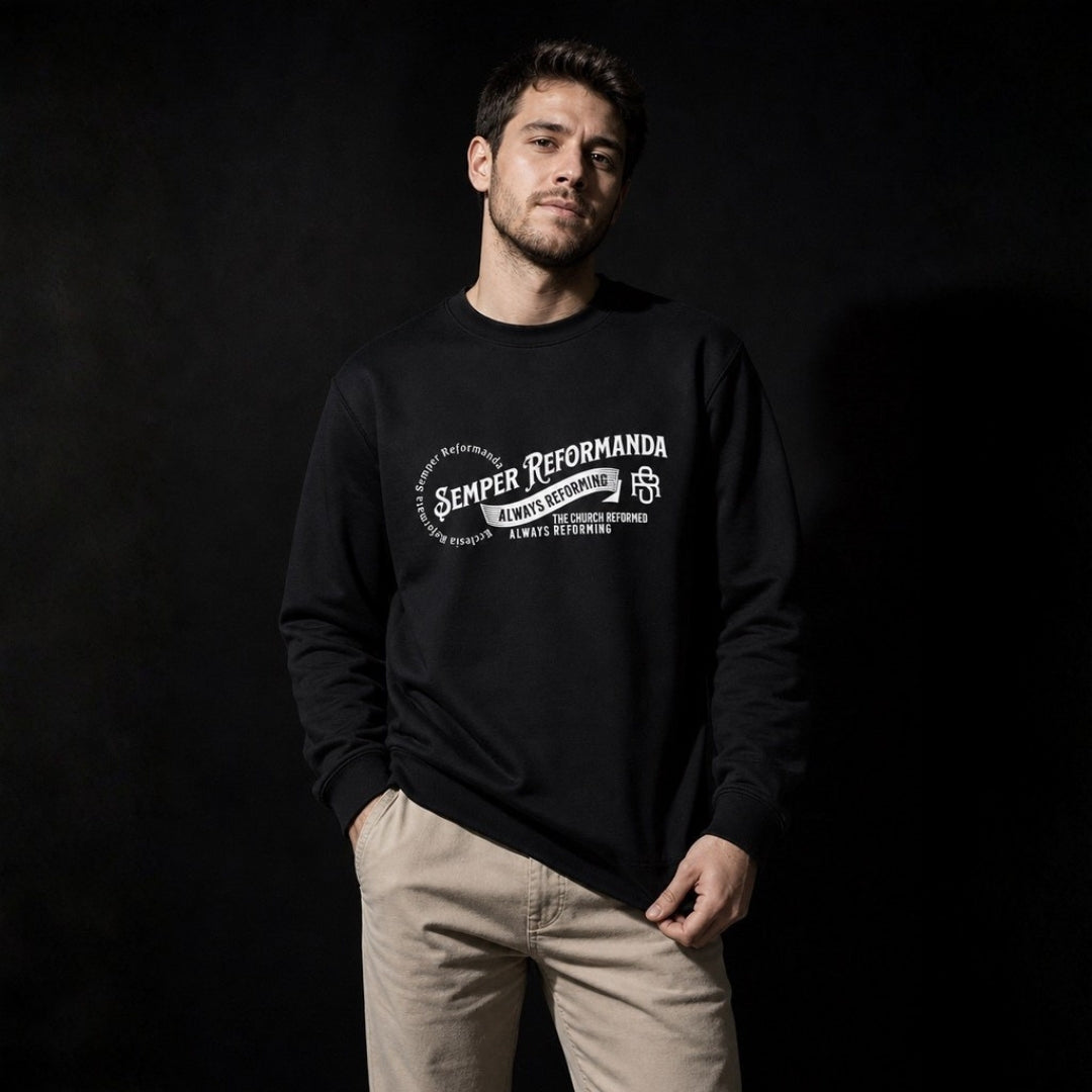 Man wearing black Semper Reformanda crewneck sweatshirt against dark studio backdrop