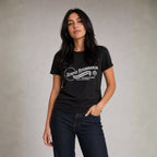 Woman wearing black Semper Reformanda unisex tee with jeans against light gray studio background