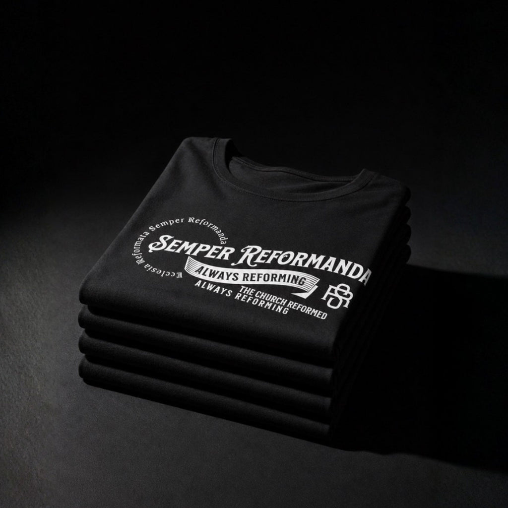 Folded black Semper Reformanda tees with white Always Reforming design