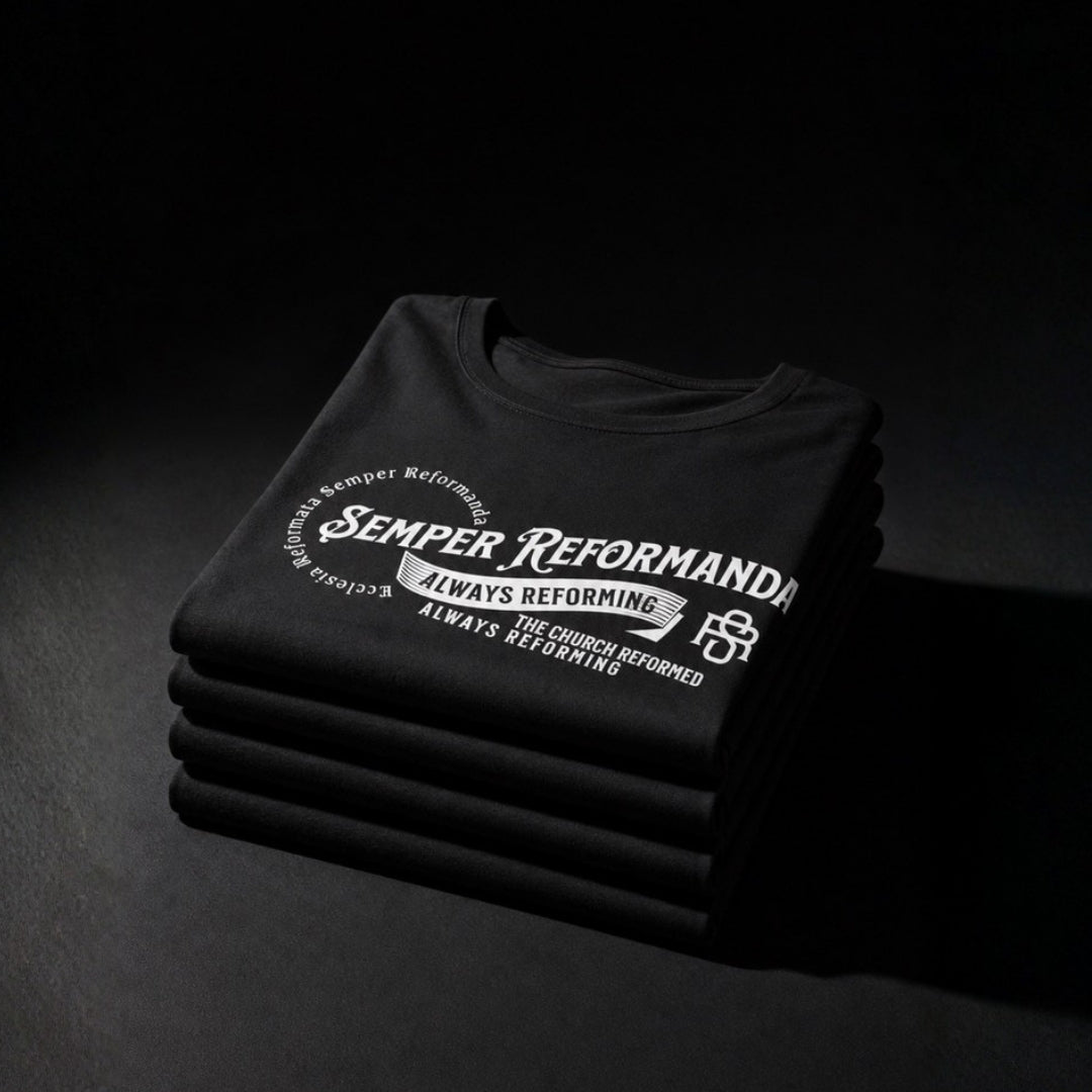 Folded black Semper Reformanda tees with white Always Reforming design