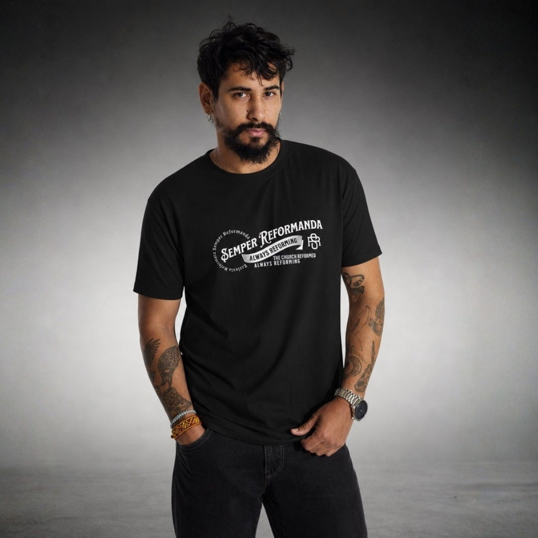 Man modeling black Semper Reformanda tee with white Always Reforming artwork on gray background