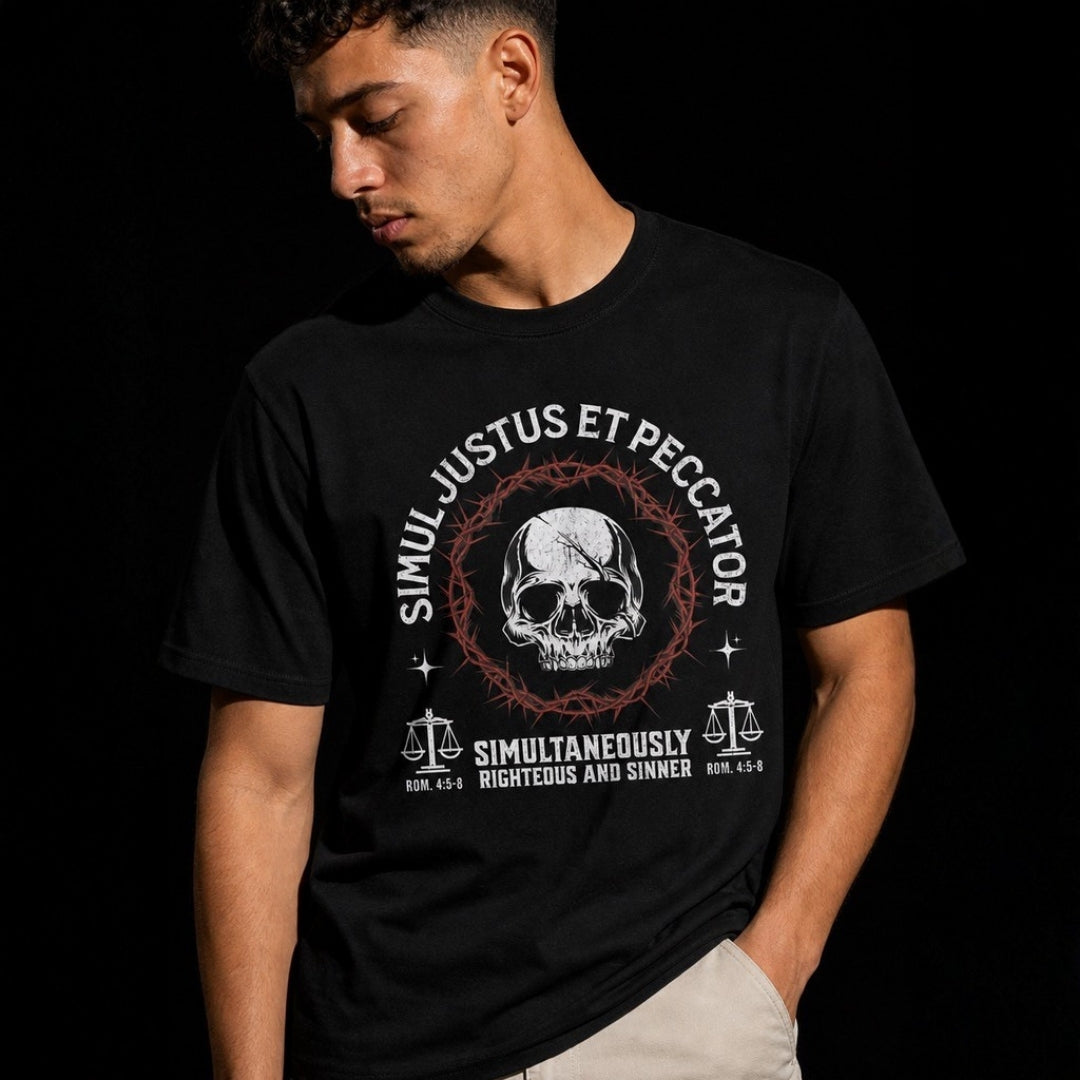 Simul Justus et Peccator black unisex tee – male model close-up on dark background